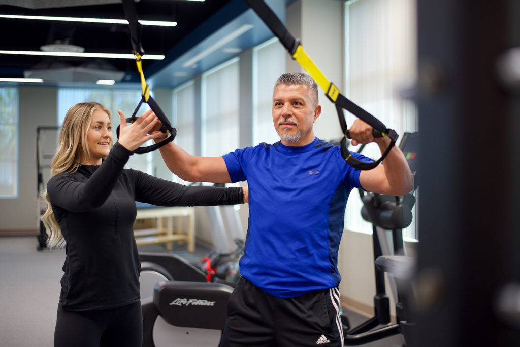 Patient exercising in the on-site gym at Hoag Executive Health in Newport