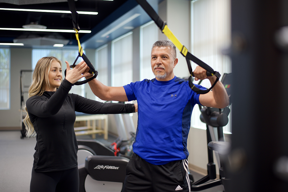 A patient working out in the on-site gym at Hoag Executive Health